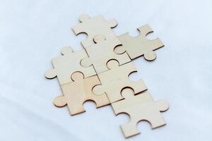 Strategic business planning office workspace puzzle pieces collaborative environment close-up problem-solving concept photo