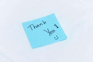 Gratitude in the workplace thank you note office desk message type professional environment close-up view business appreciation photo