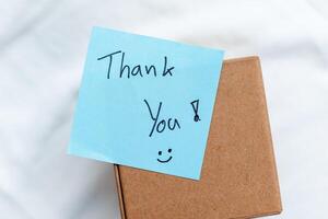 Business appreciation gesture home office thank you note calm environment close-up view gratitude concept for seo impact photo