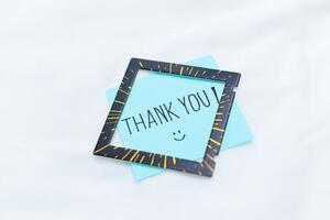 Thank you note and frame home office visual communication minimalist environment close-up view business appreciation concept photo