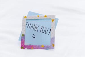 Business thank you note in a minimalist setting personal gesture office environment close-up view gratitude concept photo