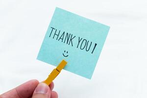 Thank you gesture in business environment handheld note minimalist setting positive vibes gratitude concept for seo impact photo