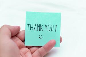 Gratitude in business thank you note office desk digital content professional setting close-up view positive vibes photo
