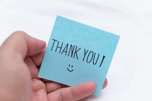 Gratitude gesture in a business context thank you note office setting visual content professional environment close-up perspective business concept photo
