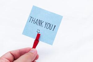 Business thank you note in hand appreciation gesture indoor setting close-up view positive vibes for seo impact photo