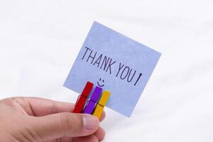 Thank you note in hand business appreciation gesture indoor setting personal touch close-up view gratitude concept photo