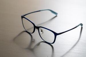 Close-up view of stylish eyeglasses in minimalist indoor setting for vision care photo