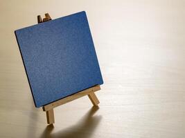 Serene studio photography featuring inspirational blue canvas on easel photo