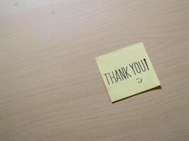 Gratitude note on sticky pad home office personal touch indoor close-up appreciation photo