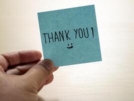 Thank you note gesture expressing gratitude in a personal indoor environment photo