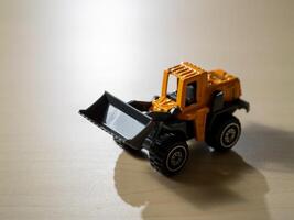 Close-up view of action mini bulldozer imaginative play with construction toy photo