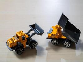 Explore indoor fun construction play with toy dump trucks for kids' imagination photo