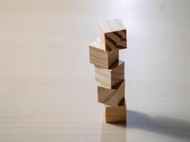 Building balance wooden blocks stacked in a minimalist home office setting photo