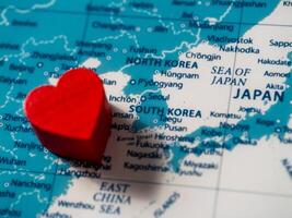 Heart-shaped love for south korea a close-up travel exploration on the map photo