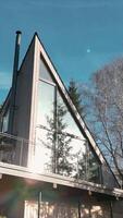 a modern house with a large window and a balcony video