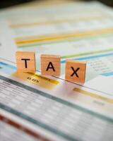 Tax preparation tactics for businesses analyzing financial reports in office settings photo