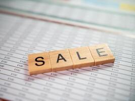 Office setting document review close-up analysis of business sale financial insights photo