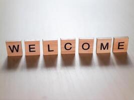 Warm welcome message displayed blocks cozy indoor setting inspirational decor unique perspective photo