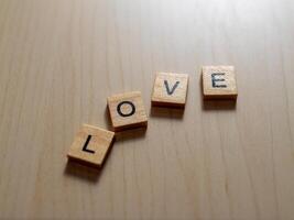 Celebrating love wooden letters minimalist table close-up serenity affection and connection photo