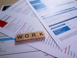 Work documents and resumes table home office business environment professional setting career focus photo