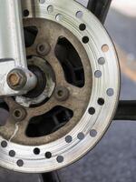 Motorcycle brake system close-up urban setting mechanical details macro view engineering insight photo