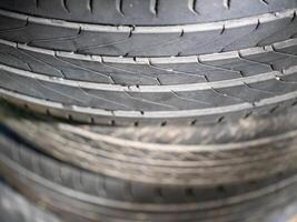 Tread patterns of used tires automotive workshop close-up indoor elevated angle industrial concept photo