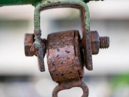 Rusty pulley mechanism macro industrial detail showcasing functionality in urban environment photo