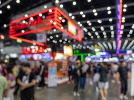 Wide angle view vibrant trade show and business networking at urban convention center photo