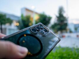 Smartphone capture urban setting technology image evening light close-up view modern lifestyle photo