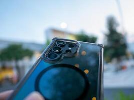 Capturing the future smartphone showcase urban setting evening close-up technology insights photo