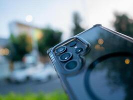 Capturing technology smartphone close-up in urban setting nature background photo