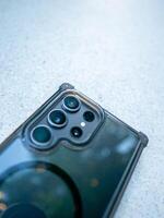 Close-up action of smartphone camera outdoor setting modern technology creative perspective photo