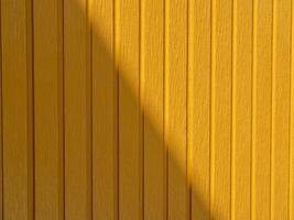 Urban setting vibrant yellow wall texture and bright color theory close-up photo