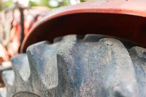 Tractor tire close-up farm location high-resolution image rural environment ground level viewpoint photo