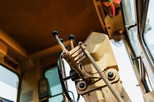 Engineering concept close-up of heavy machinery control panel in construction environment photo