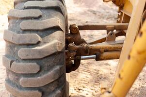 Ground-level view of heavy machinery action in industrial construction environment close-up focus photo