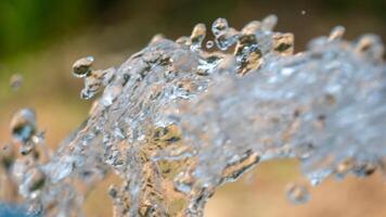 Dynamic water splash natural setting close-up vibrant colors artistic view fluid motion photo