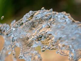 Dynamic water splash action outdoor setting nature close-up view refreshing concept photo