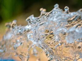 Dynamic water splash action outdoor setting nature close-up view fluid motion photo