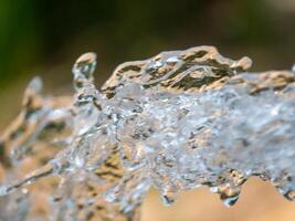 Water splashing action natural setting close-up outdoor environment dynamic viewpoint photo