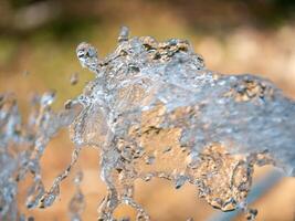 Water splashes in motion nature setting outdoor environment close-up view fluid dynamics photo