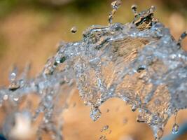 Water splashing action nature scene close-up outdoor environment dynamic view fluid motion photo