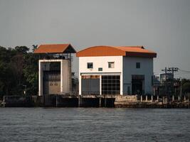 Industrial structure by the river urban location building daytime serene environment photo