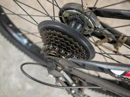 Bicycle gear mechanism close-up workshop industrial setting detailed view engineering concept photo