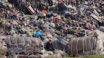Mountains of plastic waste and debris are visible at a landfill, illustrating the severe pollution issues caused by inadequate waste disposal video