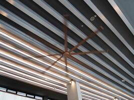 Ceiling fan modern space indoor design contemporary low angle view airflow concept photo