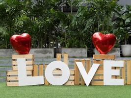 Celebrating love with red hearts urban garden decorative art outdoor close-up romantic vibes photo