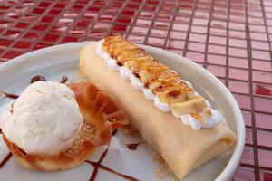Indulging in a delicious dessert platter at a local outdoor gathering with creamy treats photo