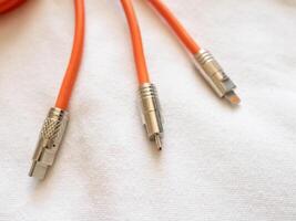 Connecting cables audio technology components a white surface close-up perspective photo