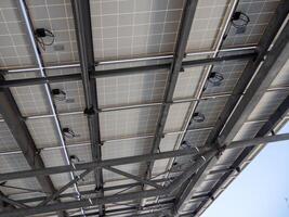 Documenting solar panel installation urban environments an upward view of renewable energy photo